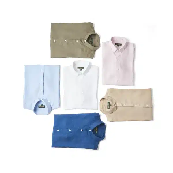 An Array of DEZHART shirts in beige, white, blue, and pink embody SITL Enterprise LLC’s dedication to quality and trust.