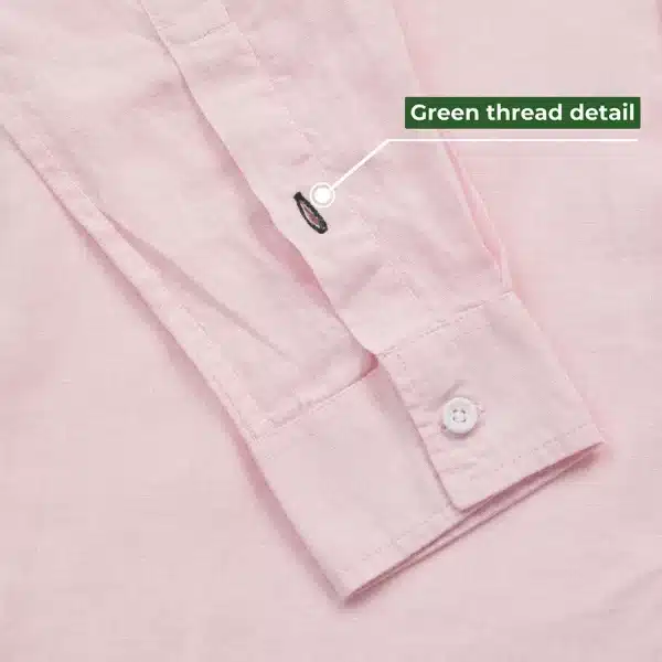 DEZHART pink shirt with signature green thread detail, exemplifying SITL Enterprise LLC’s quality