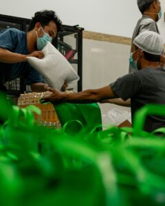 Volunteers packing essential supplies for disaster relief.